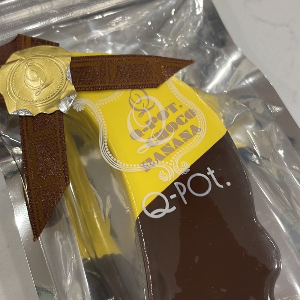 NWT Q-Pot Japan Squishy Chocolate Covered Banana ๐ Keychain - Picture 1 of 6